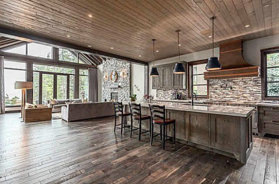 Open concept kitchen - large transitional l-shaped dark wood floor and brown floor open concept kitchen idea in Vancouver with an undermount sink, shaker cabinets, gray cabinets, multicolored backsplash, matchstick tile backsplash and an island