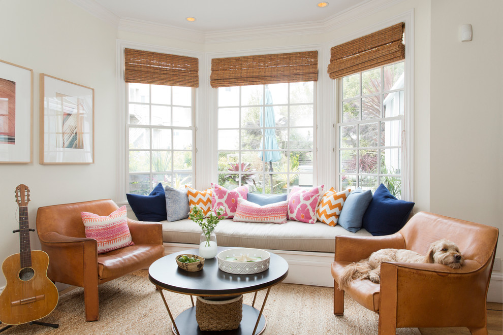 Transitional formal living room in San Francisco with beige walls and light hardwood floors.