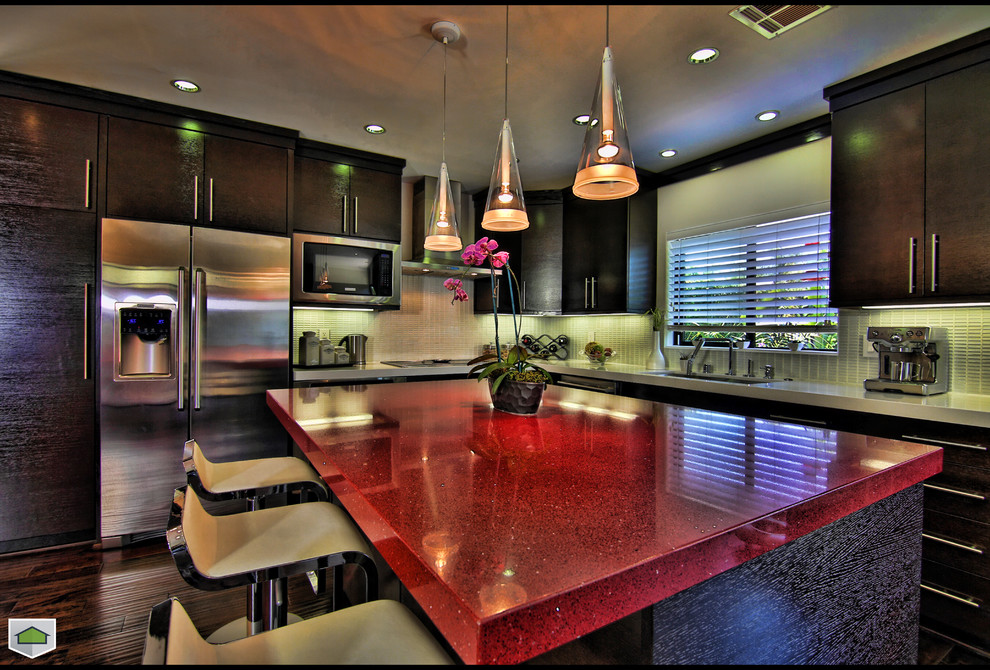 This is an example of a modern kitchen in San Diego with red benchtop.