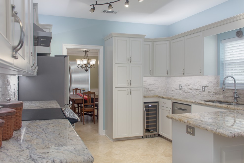 Eat-in kitchen - large transitional galley eat-in kitchen idea in Miami with flat-panel cabinets and white cabinets