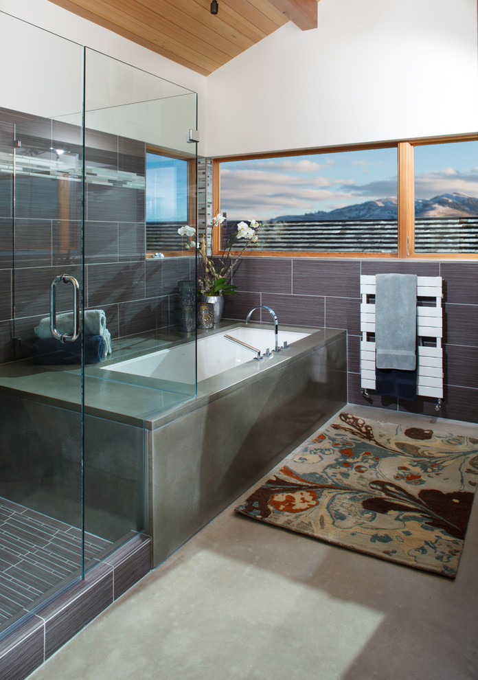 This is an example of a contemporary bathroom in Other with an alcove tub.