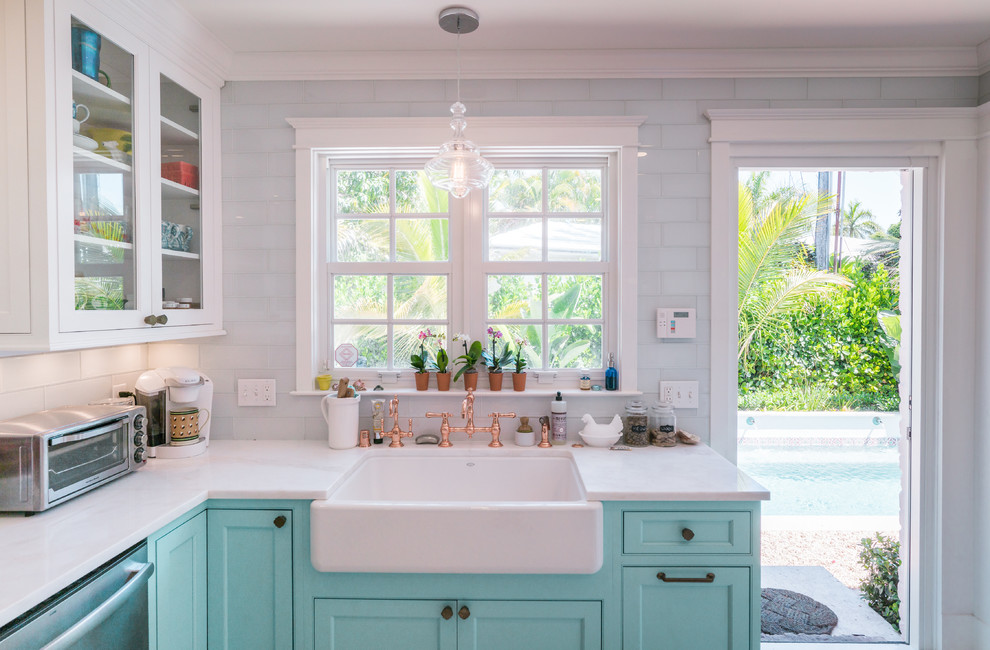 Tropical kitchen in Other with beaded inset cabinets, turquoise cabinets, marble benchtops, painted wood floors and white floor.