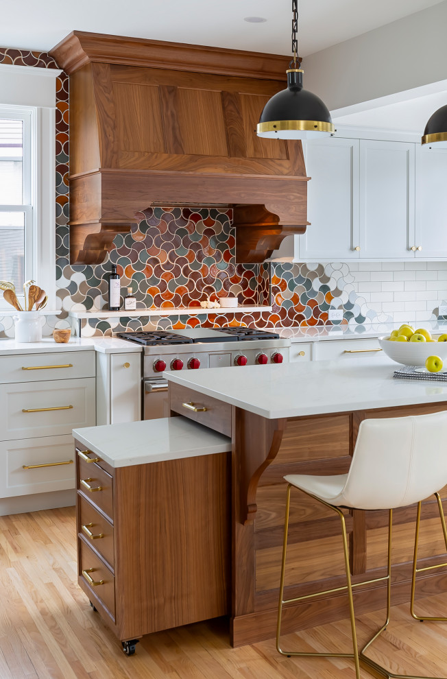 Eat-in kitchen - large transitional u-shaped light wood floor and beige floor eat-in kitchen idea in Minneapolis with a farmhouse sink, recessed-panel cabinets, blue cabinets, quartz countertops, multicolored backsplash, ceramic backsplash, stainless steel appliances, an island and white countertops