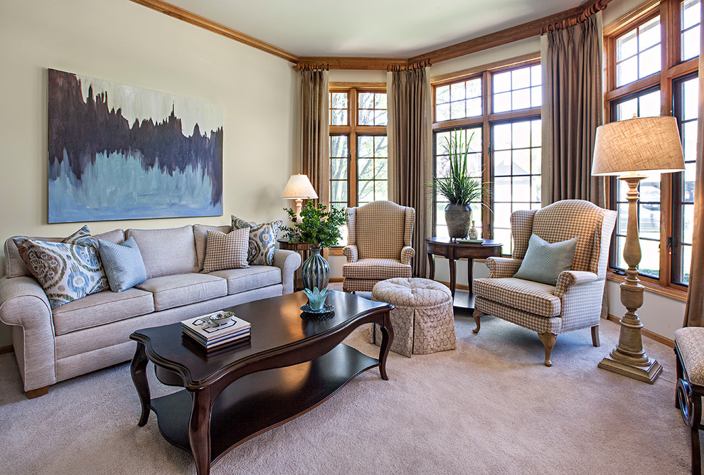 This is an example of a large traditional formal enclosed living room in Chicago with beige walls, carpet, no fireplace and beige floor.