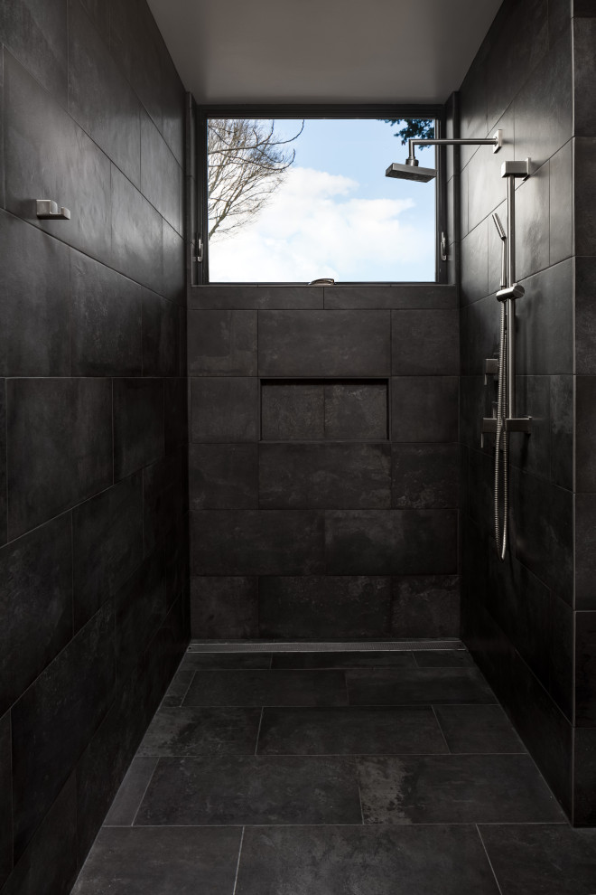 Photo of a small contemporary ensuite bathroom in Portland with flat-panel cabinets, light wood cabinets, a built-in shower, a one-piece toilet, grey tiles, ceramic tiles, grey walls, ceramic flooring, an integrated sink, grey floors, an open shower, white worktops, a single sink and a floating vanity unit.
