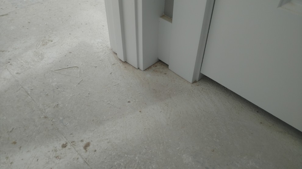 Carpet goes under baseboard and trim?