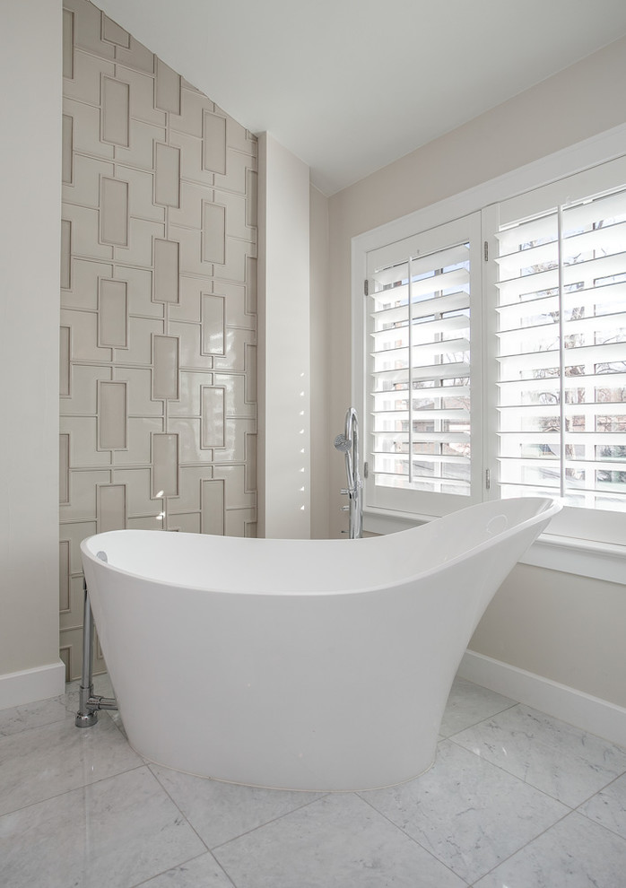 Photo of a mid-sized transitional master bathroom in Denver with shaker cabinets, white cabinets, a freestanding tub, white tile, white walls, ceramic floors, a drop-in sink and granite benchtops.