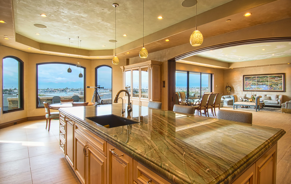 Inspiration for a large open plan kitchen in Orange County with an undermount sink, beige cabinets, marble benchtops, green splashback, marble splashback, stainless steel appliances and with island.