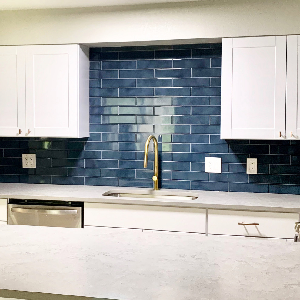 Eat-in kitchen - small transitional u-shaped ceramic tile, beige floor and wood ceiling eat-in kitchen idea in Austin with a single-bowl sink, shaker cabinets, white cabinets, quartz countertops, blue backsplash, porcelain backsplash, stainless steel appliances, a peninsula and gray countertops