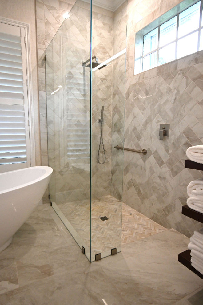 Large contemporary master bathroom in Miami with recessed-panel cabinets, brown cabinets, a freestanding tub, an open shower, a two-piece toilet, beige tile, ceramic tile, beige walls, ceramic floors, an undermount sink, quartzite benchtops, beige floor, an open shower, white benchtops, an enclosed toilet, a double vanity, a built-in vanity and wallpaper.