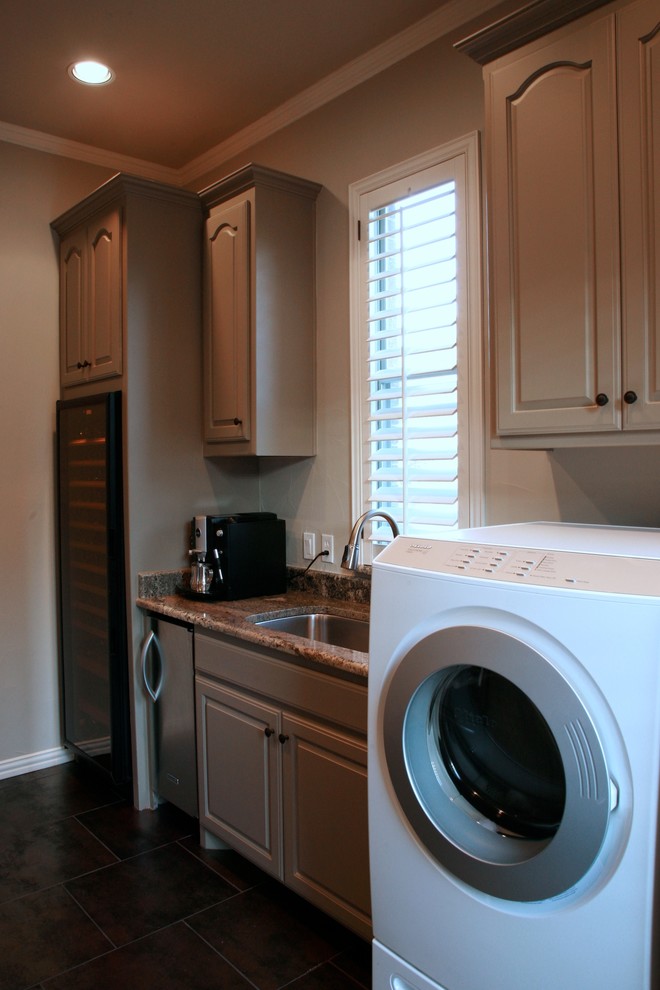 This is an example of a traditional laundry room in Dallas.