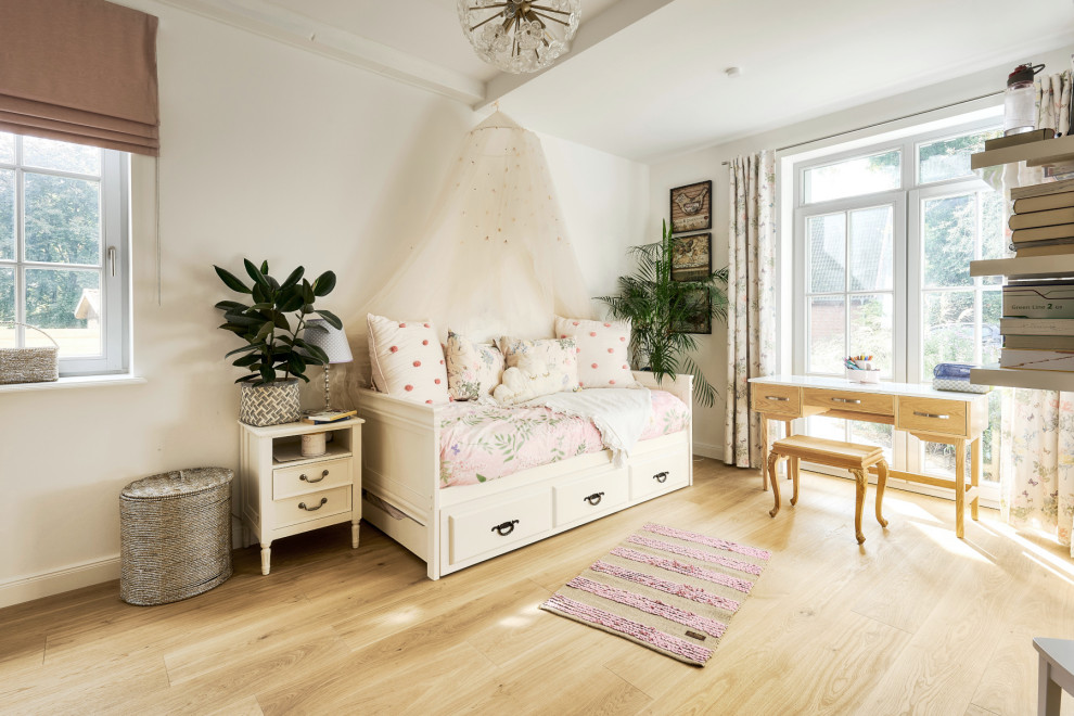 This is an example of a mid-sized traditional teen room in Hanover with light hardwood floors and brown floor.