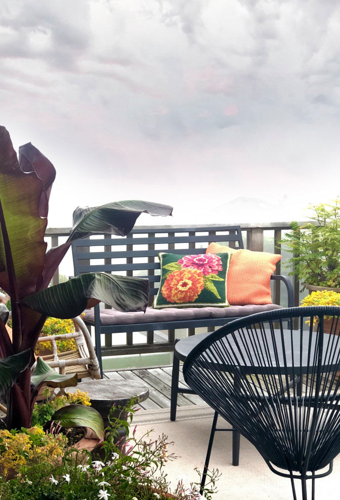 Mid-sized eclectic two-story and backyard wood beige deck photo with no cover
