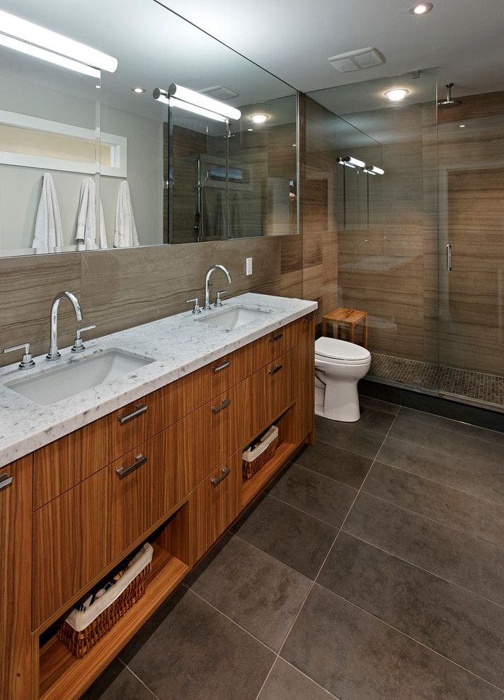 Inspiration for a contemporary bathroom in Toronto with an undermount sink, flat-panel cabinets, medium wood cabinets, an alcove shower and brown tile.