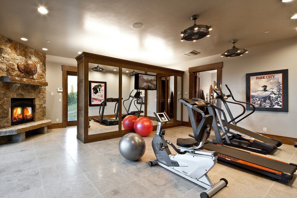 Photo of a traditional home gym in Salt Lake City with beige walls and grey floor.