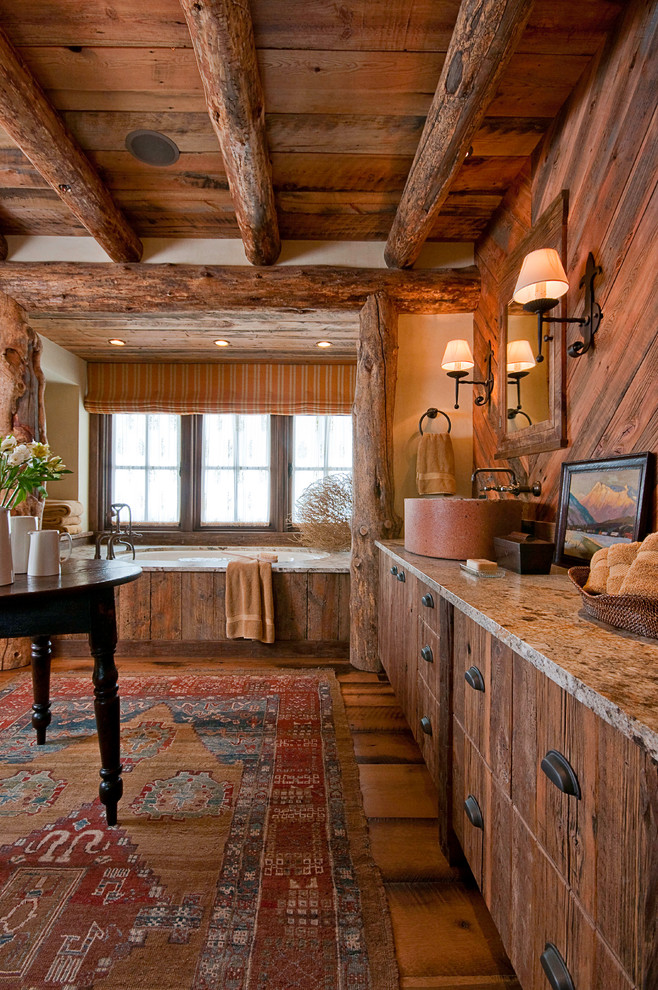 Bathroom - rustic dark wood floor bathroom idea with flat-panel cabinets, dark wood cabinets, an undermount tub and beige walls