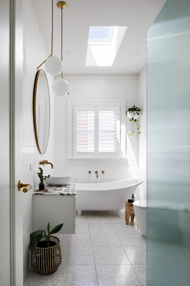 This is an example of a medium sized contemporary family bathroom in Melbourne with white cabinets, a claw-foot bath, a walk-in shower, white tiles, porcelain tiles, terrazzo flooring, a pedestal sink, marble worktops, white floors, an open shower, pink worktops, a single sink and a floating vanity unit.