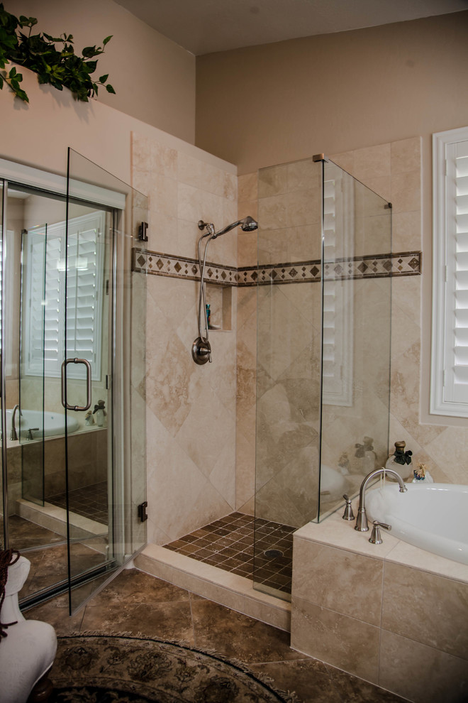 This is an example of a large transitional master bathroom in Phoenix with raised-panel cabinets, light wood cabinets, a drop-in tub, a corner shower, beige walls, ceramic floors, an undermount sink and granite benchtops.
