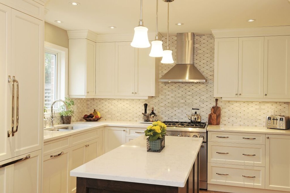 Kitchen - mid-sized transitional l-shaped medium tone wood floor kitchen idea in Ottawa with a double-bowl sink, recessed-panel cabinets, white cabinets, quartz countertops, gray backsplash, stone tile backsplash, stainless steel appliances and an island