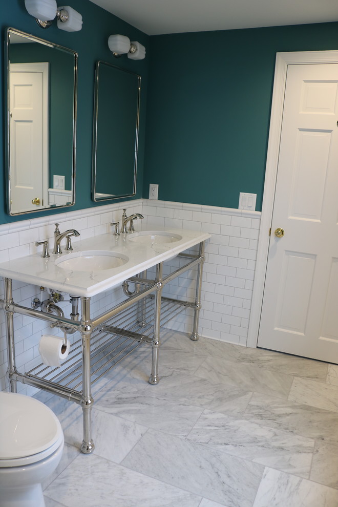 Mid-sized transitional 3/4 bathroom in Grand Rapids with open cabinets, a corner shower, a one-piece toilet, white tile, ceramic tile, green walls, marble floors, an undermount sink, engineered quartz benchtops, white floor, a hinged shower door and white benchtops.