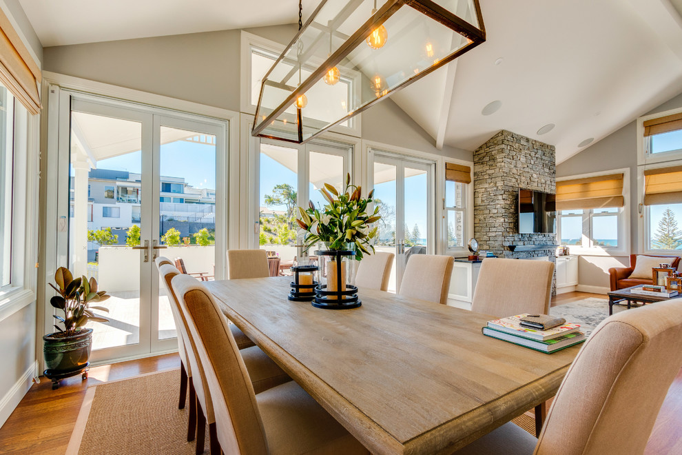 Design ideas for a beach style dining room in Other.