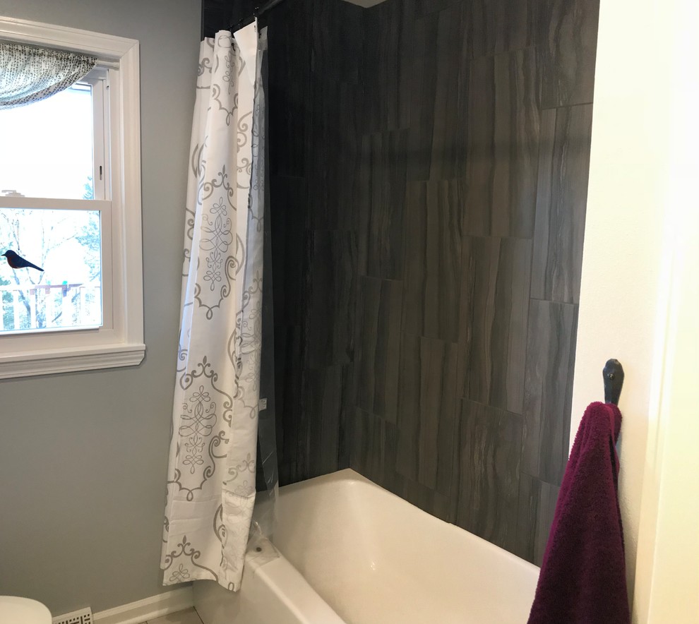 Home design - mid-sized transitional home design idea with recessed-panel cabinets, white cabinets, a one-piece toilet and white countertops