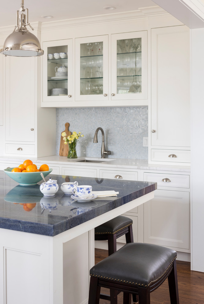 Inspiration for a mid-sized traditional l-shaped open plan kitchen in New York with an undermount sink, shaker cabinets, white cabinets, quartzite benchtops, blue splashback, mosaic tile splashback, panelled appliances, medium hardwood floors and with island.