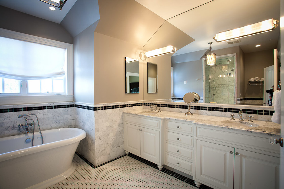 Example of a large transitional master multicolored tile and ceramic tile ceramic tile and gray floor freestanding bathtub design in DC Metro with an undermount sink, furniture-like cabinets, white cabinets, marble countertops, a two-piece toilet and gray walls