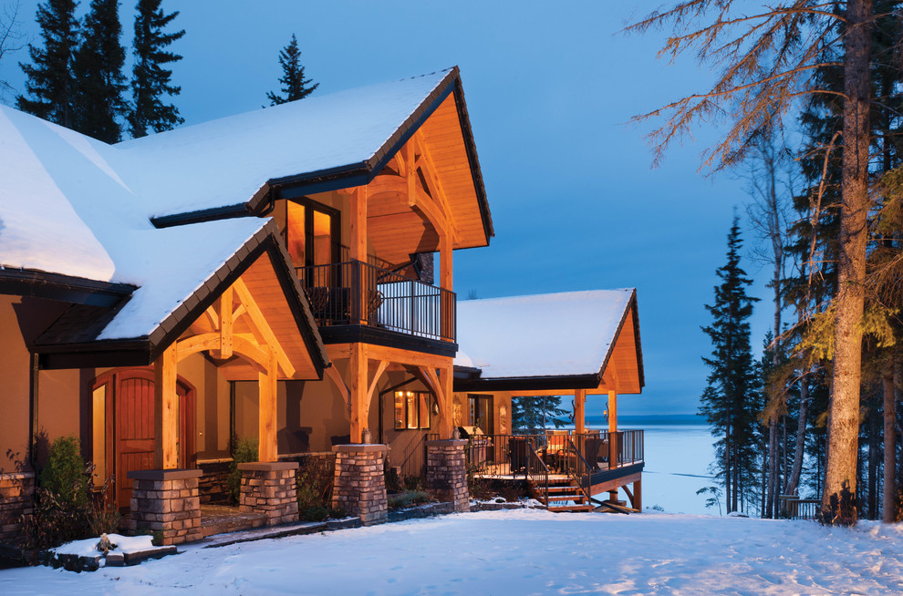 Inspiration for a country three-storey brown exterior in Edmonton with mixed siding.