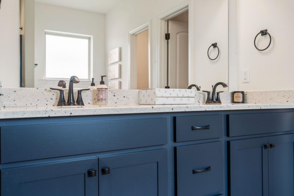 This is an example of a mid-sized traditional master bathroom in Other with blue cabinets, white walls, medium hardwood floors, granite benchtops, brown floor, white benchtops, a double vanity and a built-in vanity.