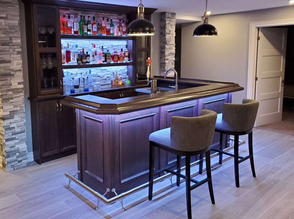 Photo of a medium sized modern u-shaped breakfast bar in Other with a submerged sink, floating shelves, dark wood cabinets, wood worktops, laminate floors, multi-coloured floors, brown worktops and feature lighting.