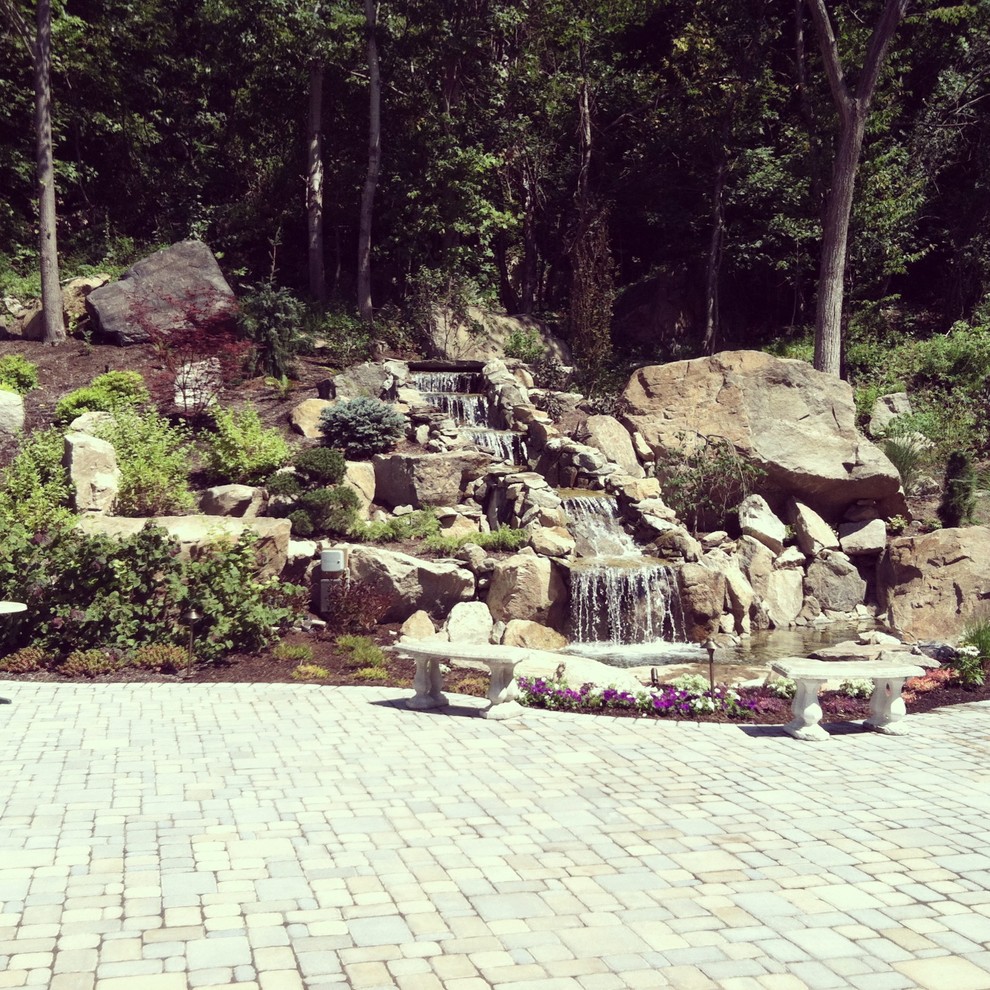 before and after landscape waterfall pond and paver patio
