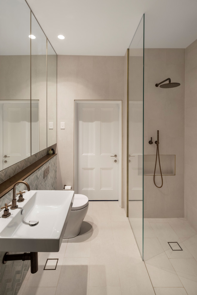 Design ideas for a mid-sized contemporary bathroom in Sydney with marble and a single vanity.