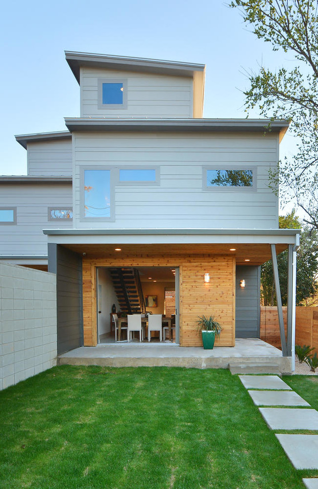 Photo of a contemporary three-storey blue exterior in Austin.