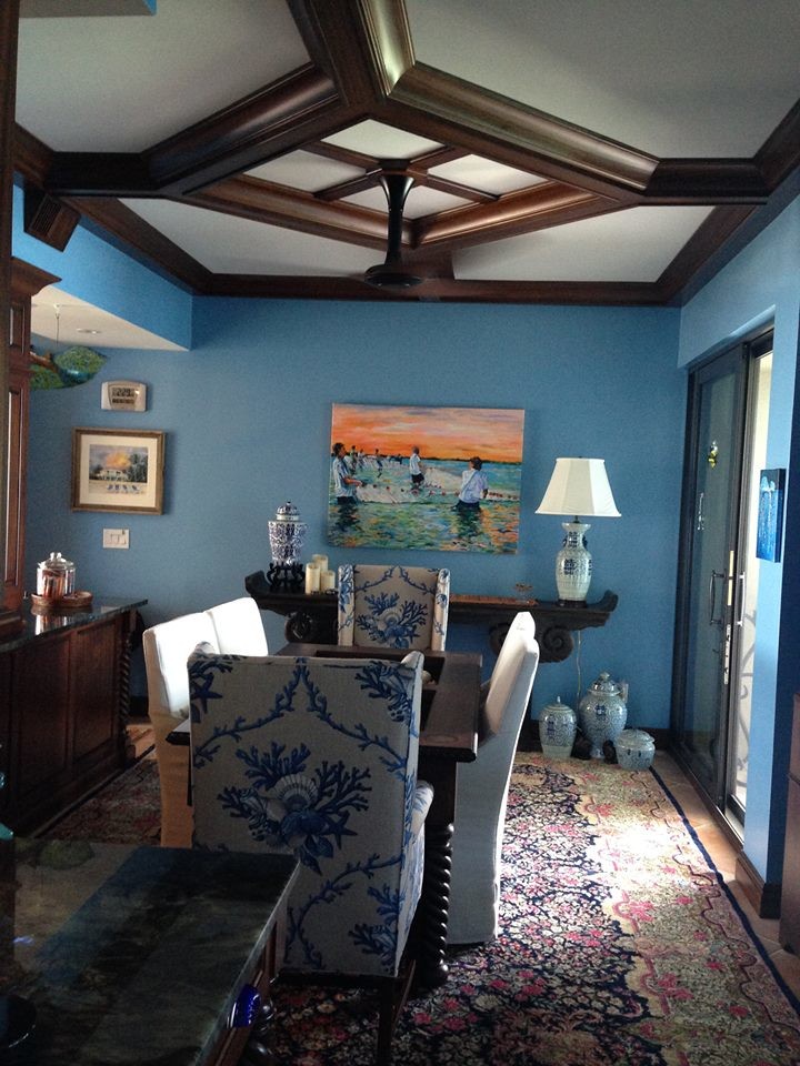 Design ideas for a beach style dining room in Miami with blue walls and carpet.