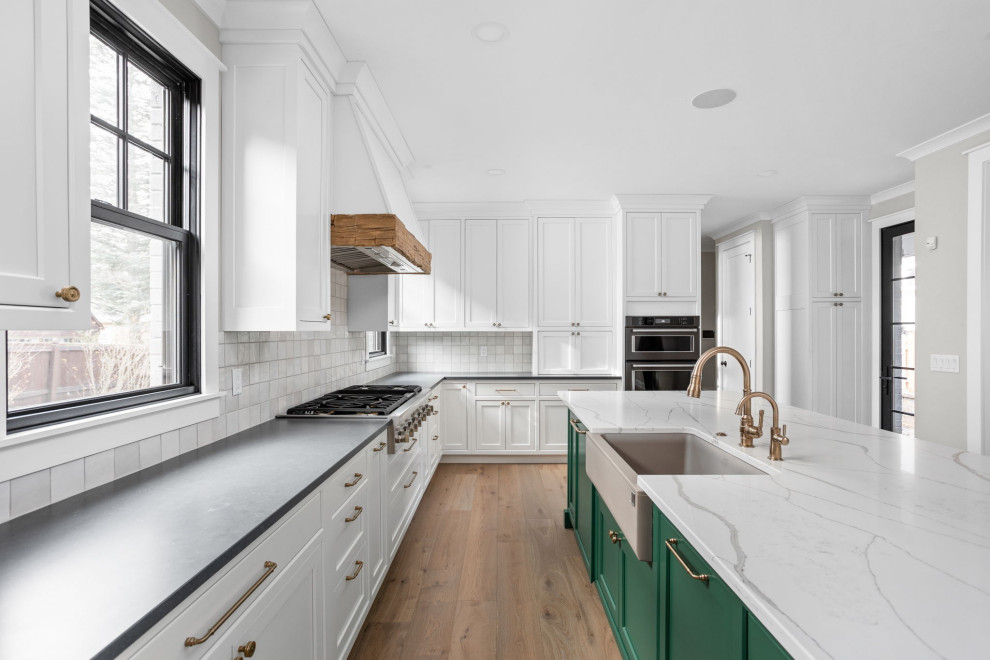 Kitchen - kitchen idea in Indianapolis with beaded inset cabinets, white cabinets, quartz countertops and an island