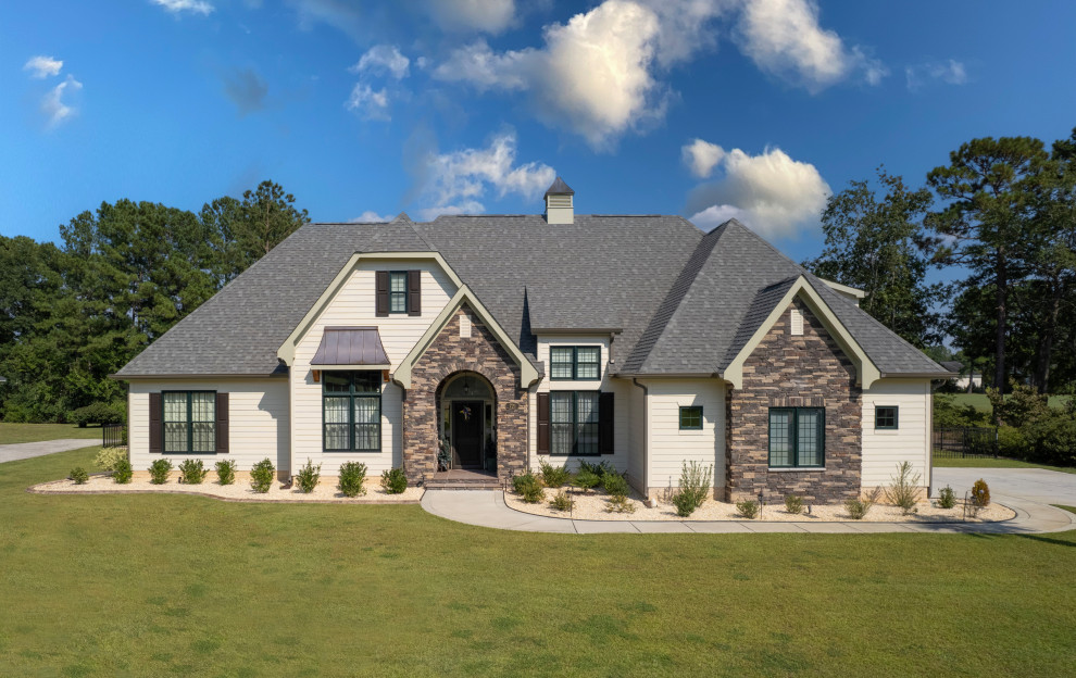 Example of a french country exterior home design in Other