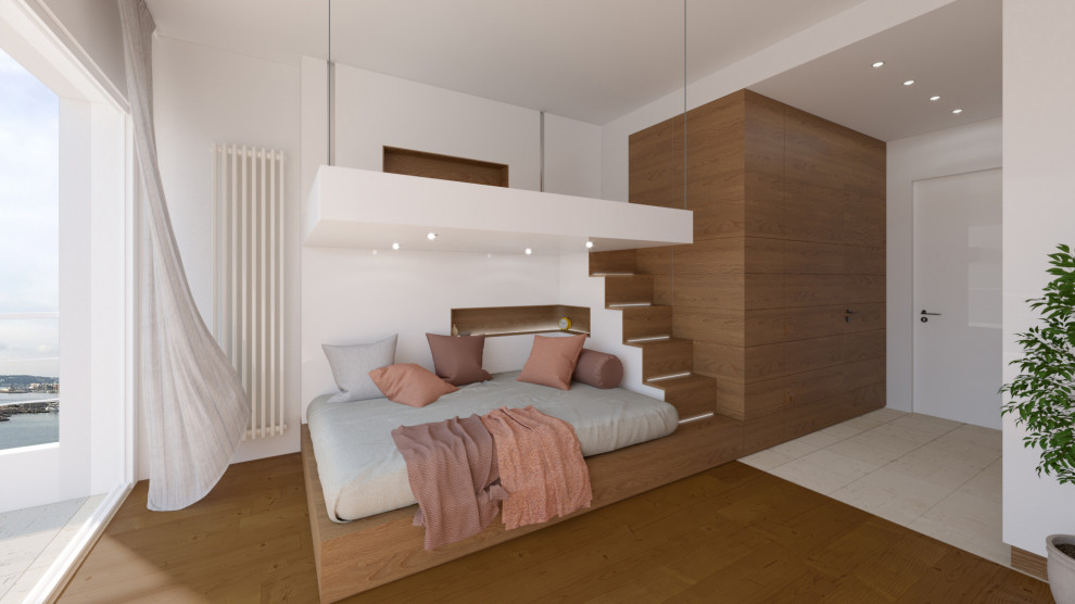 Diseño de dormitorio tipo loft nórdico pequeño con paredes blancas, suelo de madera en tonos medios y madera