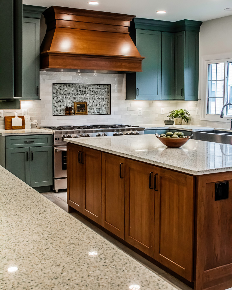 Photo of an expansive transitional u-shaped eat-in kitchen in DC Metro with a farmhouse sink, shaker cabinets, green cabinets, recycled glass benchtops, vinyl floors, with island, beige floor and beige benchtop.
