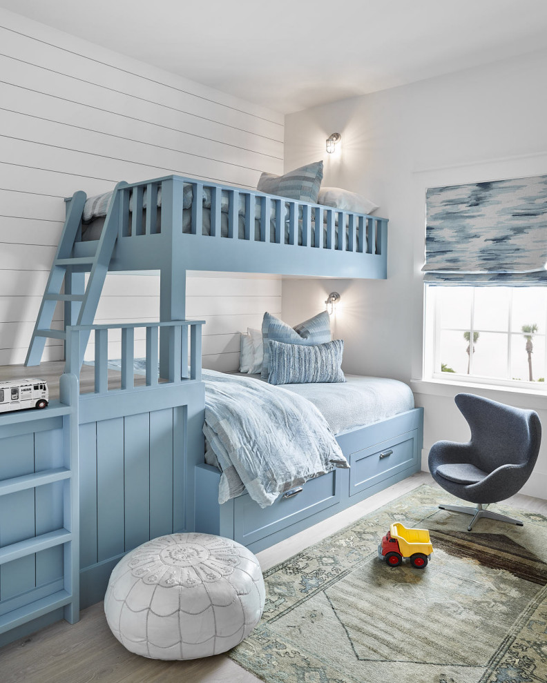 Beach Bungalow - Inspiration for a bedroom and mid-sized coastal boy light wood floor and white floor kids' bedroom remodel in Houston with white walls