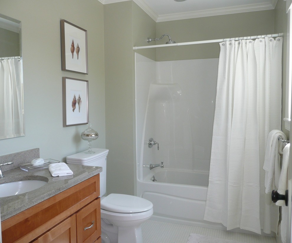 Inspiration for a mid-sized transitional master bathroom in Boston with a wall-mount sink, recessed-panel cabinets, medium wood cabinets, engineered quartz benchtops, an alcove tub, a one-piece toilet, green walls and mosaic tile floors.
