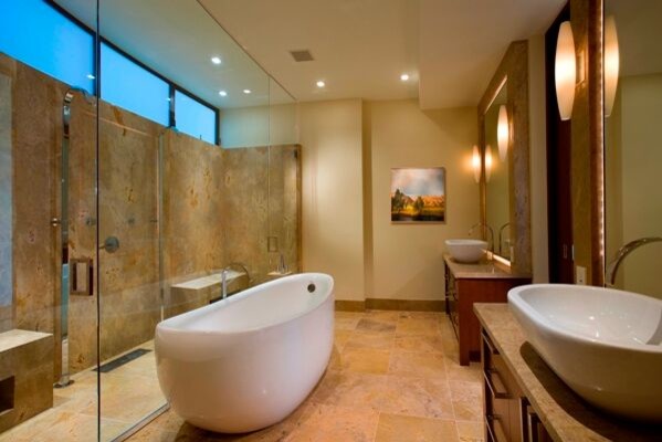 Photo of an expansive contemporary master bathroom in Los Angeles with medium wood cabinets, a freestanding tub, a double shower, beige tile, beige walls and a vessel sink.