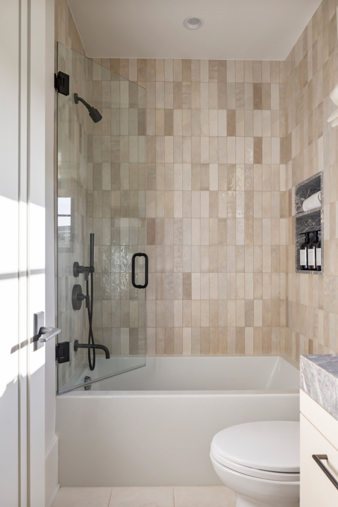 This is an example of a large transitional 3/4 bathroom in Los Angeles with beaded inset cabinets, light wood cabinets, an alcove shower, a one-piece toilet, gray tile, marble, white walls, terra-cotta floors, an undermount sink, marble benchtops, white floor, a hinged shower door, multi-coloured benchtops, a single vanity and a built-in vanity.