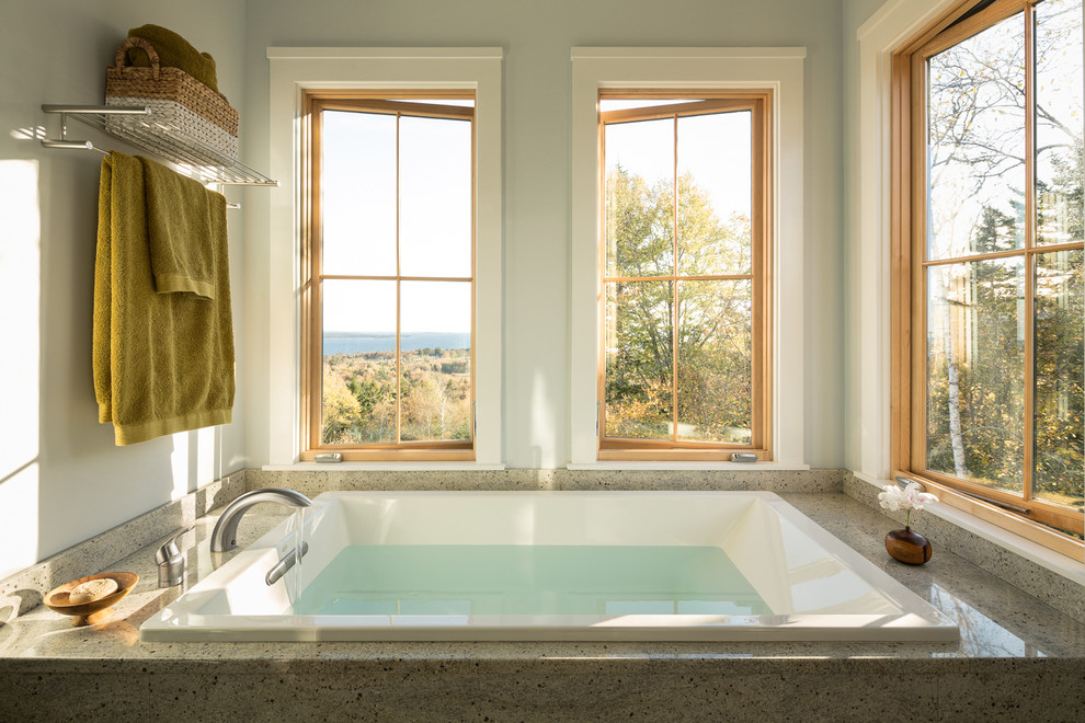 Photo of a transitional bathroom in Portland Maine with a drop-in tub.