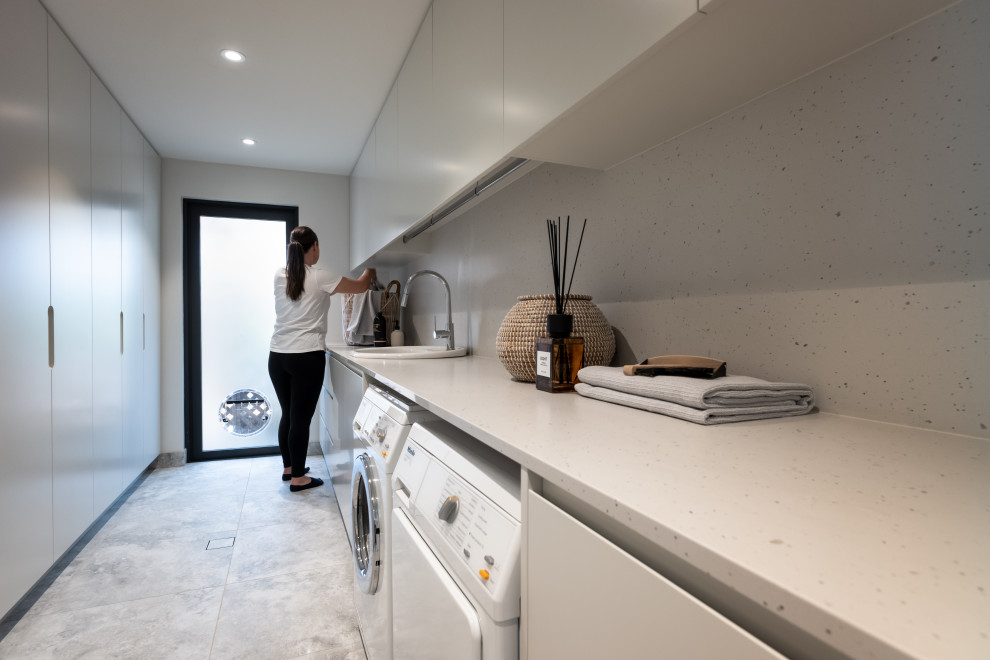 Photo of a contemporary utility room in Sydney.