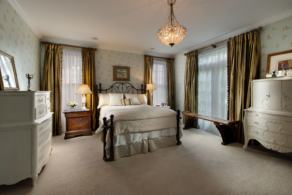 This is an example of a large traditional master bedroom in DC Metro with carpet and beige floor.