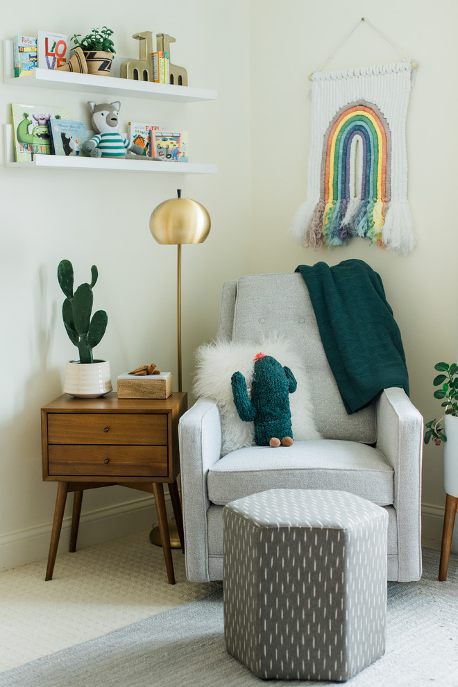 This is an example of a mid-sized midcentury gender-neutral nursery in Minneapolis with white walls, carpet and white floor.