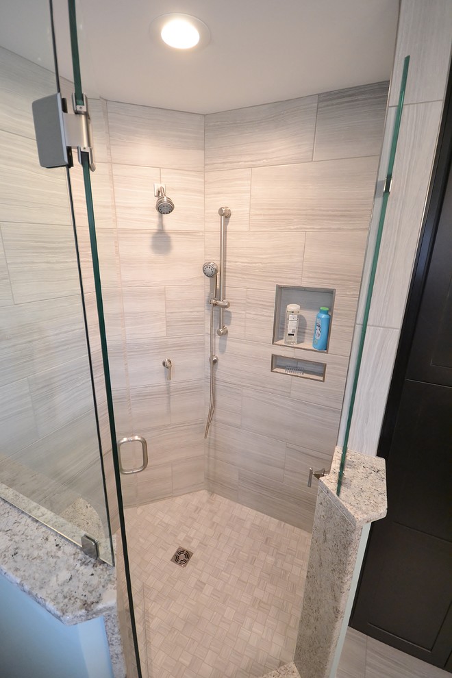 Large transitional master beige tile and ceramic tile ceramic tile corner shower photo in Philadelphia with raised-panel cabinets, white cabinets, a one-piece toilet, beige walls, an undermount sink and granite countertops
