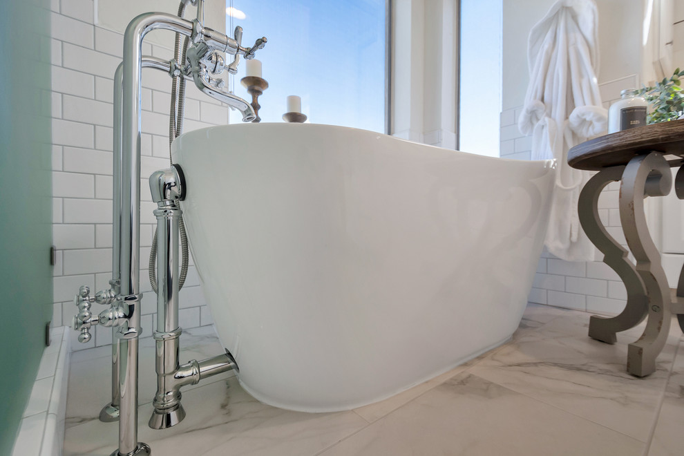 Mid-sized transitional master white tile and subway tile porcelain tile and white floor freestanding bathtub photo in Phoenix with a hinged shower door