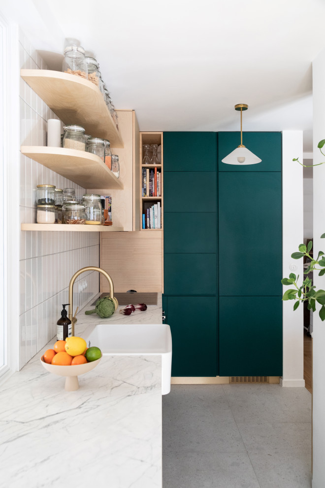 Medium sized modern l-shaped open plan kitchen in Paris with a single-bowl sink, beaded cabinets, green cabinets, marble worktops, white splashback, porcelain splashback, integrated appliances, ceramic flooring, an island, grey floors and white worktops.